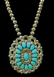 Navajo Turquoise & Silver Necklace - Julie Lahi: Classic, cluster design, oval shaped, pin/pendant/concho, strung on small, traditional silver beads. Very good condition. Signed. Ca. 1970s. 30", 3" x 3-1/2"