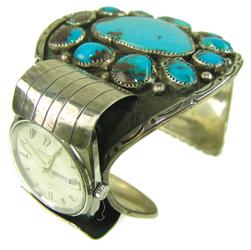 Navajo Watch Bracelet - Miriam Chayute: Large and impressive, handwrought, turquoise and silver cuff bracelet done in traditional style using Bisbee blue stones, with a unique, offset, watch mount. Very good condition (watch condition unkno