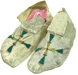 Sioux Beaded Moccasins: Classic old pair of sinew sewn, lazy stitch beaded, child's or ladies, buckskin moccasins with hard, rawhide soles, and duplex cross symbols on the vamps. Good condition, rawhide split in two places. 