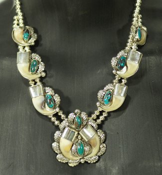 Navajo Turquoise & Claw Necklace: Son of Bear, Very fine sterling bead necklace with 6 matching segments and naja set with Bisbee turquoise and mountain lion claws, signed. Condition: new. Circa new. 22"
