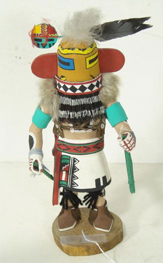 Hopi Kachina Doll: William James, Outstanding hand carved and painted "Hilili" kachina showing the dancer with his sticks in full costume, signed. Condition: very good, 1 piece on the headdress was re-attached. Circa la