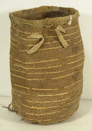 Yakima/Plateau Sally Bag: Traditional, old, woven 2-color basketry bag with banded husk designs and buckskin trim. Condition: good, shows a lot of use but intact, unrepaired. Circa early 1900s. 11" high x 7" diameter.