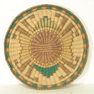 Hopi Basketry Plaque: Fine 3rd Mesa wicker plaque with symmetrical design, faded colors original on back, enhanced with paint on front. Condition: very good overall. Circa 1960s. 11-1/2"