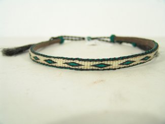 Woven Horsehair Hatband: Superfine, double-hitched, solid horsehair hatband done in black, white and green. Made at Montana State Prison, Deer Lodge. Circa late 1900s. Adjustable