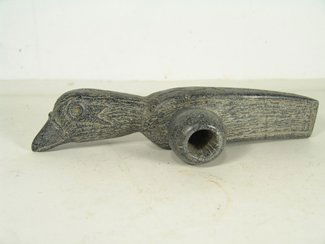 Carved Stone Bird Pipe: Very large hand carved mottled stone pipe head done in eagle/bird form. Condition: very good. Circa late 1900s. 10 3/4" x 3 3/4" x 2"