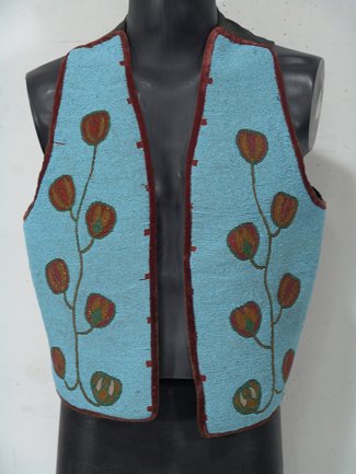 Flathead Beaded Vest: Beautiful old floral design vest with fully beaded front panels. Condition: very good, has satin back and velvet trim. Circa 1920. 22" x 21"