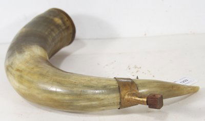 Antique Powderhorn: Large sized horn with wood cap decorated with brass cut-outs and fashioned brass spout. Condition: Very good. Circa mid 1900s. 22-1/2" end to end, 3" diameter at base