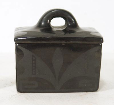 San Ildefonso Pottery Box: Maria Martinez. Rare lidded black on black square pottery box with lid signed "Marie" . Condition: Intact with a large glued rim chip near one corner and one smaller rim chip. Circa mid 1900s. 4" high