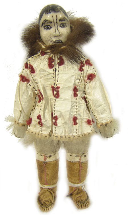 Antique Eskimo Doll: Fine hand crafted doll with carved bone head and wearing an authentic gut parka and pats, sealskin boots. 8-1/2" Circa Early/Mid 1900s