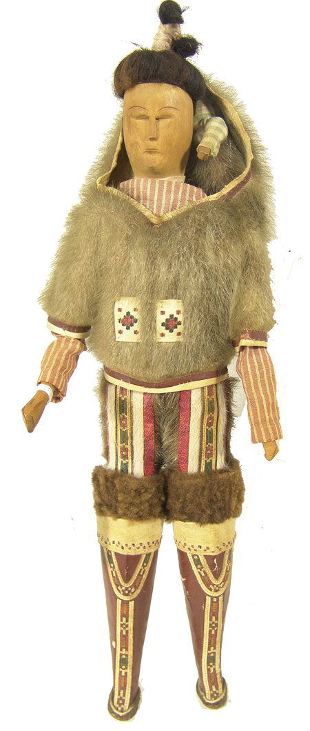 Greenland Eskimo Doll with Baby: Rare hand crafted wooden doll with carved face and hands and full traditional clothing and boots; with child tucked into the sealskin parka. 18" x 6" Circa Early/Mid 1900s