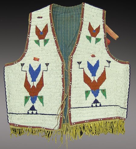 Sioux Beaded Vest: Fantastic fully beaded man's vest done in sinew sewn lazy stitch style with traditional Sioux geometric symbols; very good condition, beautiful! Men's medium Circa Early 1900s
