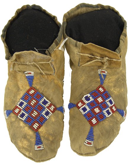 Sioux Beaded Moccasins: Classic old sinew sewn and lazy stitch beaded moccasins with cloth trimmed ankles and checked cross designs. 10-1/2" Circa Early 1900s