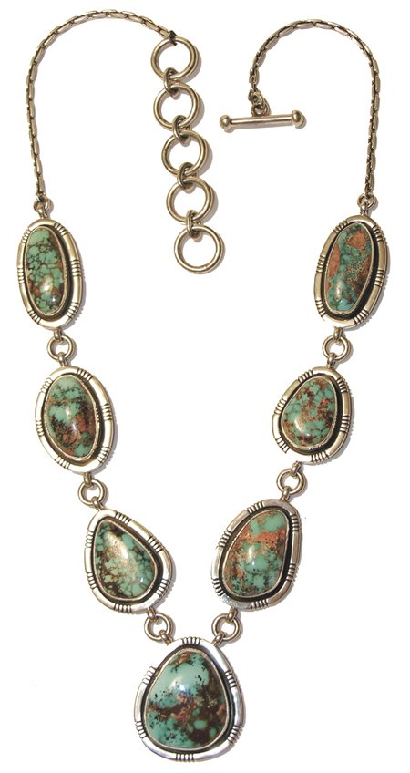 Navajo Necklace: Edison Begay, Elegant sterling and turquoise necklace set with 7 natural Pilot Mountain cabochons in file work bezels, with adjusting rings extensions - hallmarked. 20" plus rings Contemporary