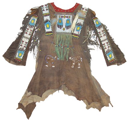 Buckskin War Shirt: Traditionally designed dark brown hide shirt with beaded strips, ermine tails, bells, long fringe, tradecloth collar, and applied beaded figures - possibly Plateau style; very good condition. Chest 39