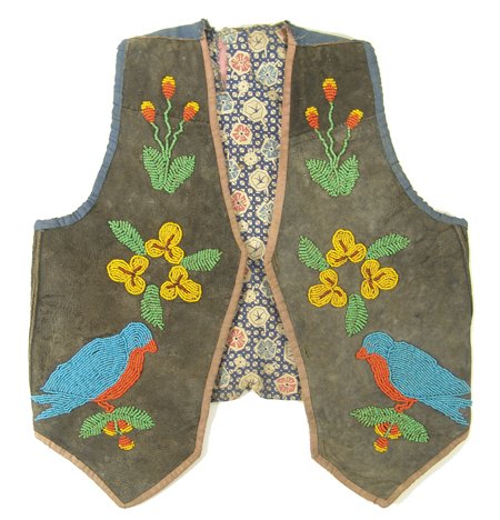 Eastern Plains Girls Vest: Unique piece made from buckskin shirt with beaded accents and commercial buttons; very good condition, shows some use. 22" across shoulders Circa Late 1800s