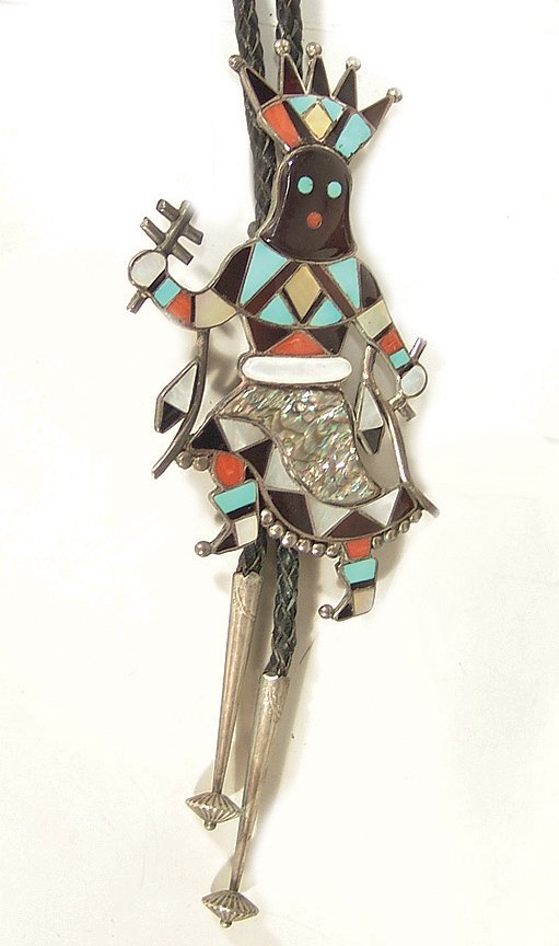Zuni Inlay Bolo Tie - Vera Luna: Outstanding channel inlay Gan Dancer bolo tie made with turquoise, coral, mother-of-pearl, jet and shell - signed. Condition: very good. 5" x 3" Circa: Ca. 1970s