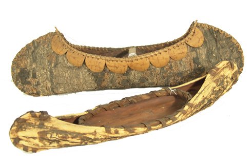 2 Woodlands Toy Canoes: Classic old pair of hand crafted birch bark canoes done in traditional style. Condition: both in good condition. 17" and 20" Circa: Early/Mid 1900s