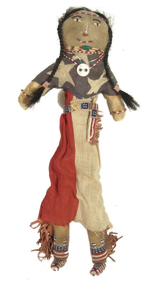 Vintage Buckskin Doll: Extra long hand crafted buckskin and cloth doll with U.S. flag dress, matching beaded belt, sheath, moccasins done in flag design, human hair, beaded face, and bead/quill necklaces. Condition: very go