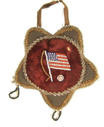 Iriquois Beaded Whimsy: Class turn-of-the-century beaded star with raised "Niagra-Style" beading and an American flag in the center. Condition: very good. 5" diameter Circa: Early 1900s