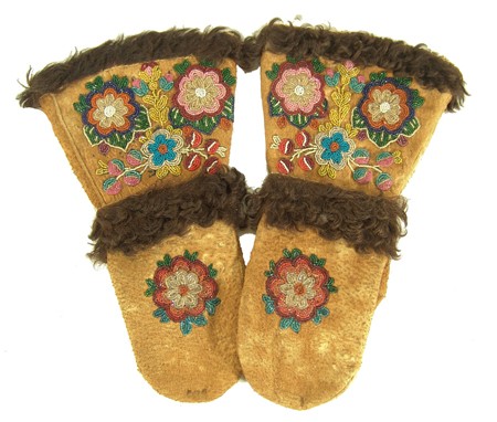 Cree Beaded Mittens: Classic pair of heavy moose hide mittens with traditional floral beaded decorations and buffalo hair trim. Condition: very good, used. 14" long Circa: 1900s