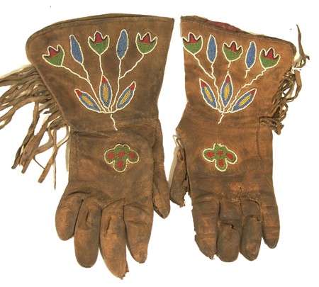 Sante Sioux Beaded Gloves: Traditional pair of old buckskin/leather gloves with beautiful contour floral beading on the hand and cuff. 12-1/2" x 7" Circa: Late 1800s