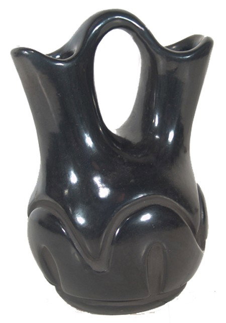 Santa Clara Pottery Wedding Vase - Helen: Small deep carved blackware vase with right-facing Avanyu figure. Signed "Helen". Condition: very good. 6-1/2" x 5" Circa: Mid to late 1900s