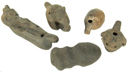 5 Mexican Items: Collection of 4 ancient hand formed clay whistles, all in very good condition, plus an even older double grooved stone axehead with human faces in excellent condition. 2-1/2" to 5-1/2" Circa: Various 