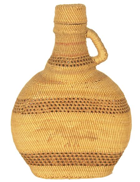 Makah Basketry Bottle: Old fine weave Nuu Chah Nulth basketry-covered bottle with handle and lid. Purchased from Grannies in 1975 for $100; appraisal value $650. Condition: very good. 6-1/2" high Circa: Early 1900s