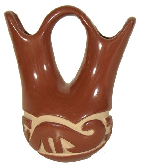 Santa Clara Pottery Jar - Mary Cain: Beautiful redware double necked wedding vase with deep carved and painted body showing the avenyu spirit figure. Condition: very good. 8" high Circa: Ca. 1970s