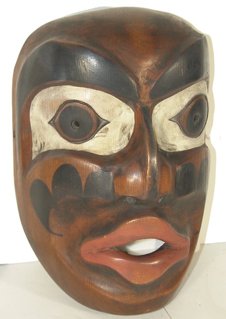Bella Coola Speakers Mask: Outstanding hand carved and painted cedar mask with traditional protruding facial features. Condition: excellent, unsigned. 10" x 7" x 5" Circa: Mid 1900s