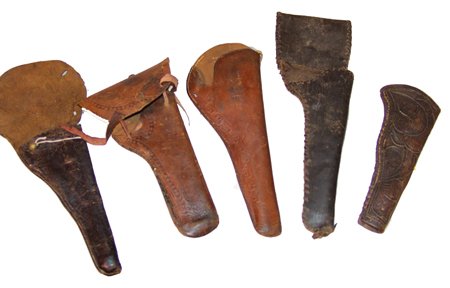 5 Old Leather Holsters: Collection of very old handmade holsters including 2 extra-large barreled, 1 handmade tooled, and 2 with military flap. Circa: Late 1800s Size: 2 @ 9", 1 @ 10", 2 @ 11-1/2"