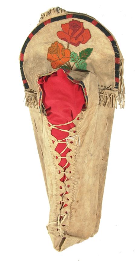 Nez Perce Cradle Board: Traditional hand-built full sized buckskin covered cradle board with beautiful beaded florals and trim and fancy scalloped lacing section. Condition: excellent. Ben Thompson collection. Size: 34" Circ