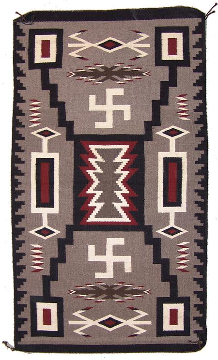 Navajo Weaving - Rena Yazzie: Outstanding tightly woven Storm Pattern rug with lightning and fylfot designs. Condition: very good. Size: 54" x 31" Circa: 1970s