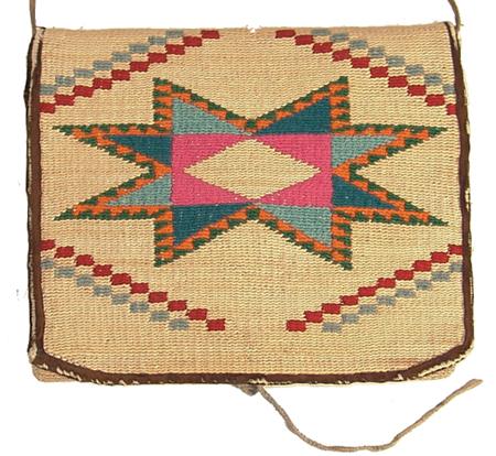 Nez Perce Cornhusk Purse: Finely woven cornhusk bag with colorful woolen geometric designs on 3 panels front, back, and flap. Condition: very good. Size: 6-1/2" x 8" Circa: Mid 1900s