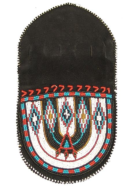 Ute Beaded Purse: Horseshoe shaped leather bag with striking beaded designs on both sides. Top has slits to run a draw string through. Size: 5" x 4-1/2" Circa: 1980s