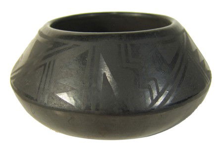 San Ildefonso Pottery- Florence Naranjo: Rare signed black on black pottery jar in good condition. Circa: Mid 1900s Size: 3" x 6"