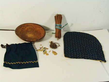 Chippewa Gaming Set: Very rare set consisting of a hand carved wooden bowl, many carved ivory and bone figural tokens and approximately 80 still markers. Ex. Bob Ward coil, Santa Fe. Very good condition, small split in bo