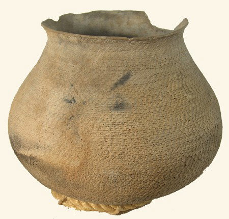 Anasazi Cooking Pot: Huge and rare corrugated cooking pot with wide mouth and blackened bottom. Very good condition, minor restoration, rim chips. Circa: Prehistoric Size: 14" x 15"