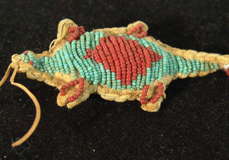 Plains Fetish: Sioux sinew sewn beaded buckskin umbilical cord fetish in lizard form. Good condition. Circa: Early-mid1900s Size: 3-1/2" x 1-3/4"
