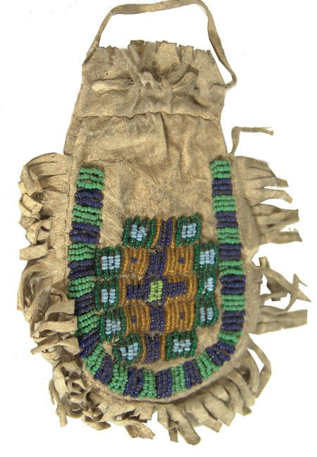 Sioux Beaded Bag: Classic shaped sinew sewn and lazy stitch beaded buckskin bag with front design and fringed edges. Very good condition. Circa: 1940s Size: 6" x 4"