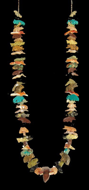 Pueblo Fetish Necklace: Traditional finely carved turquoise, shell, and gemstone necklace strung on shell heshi with buffalo, birds, rabbits, foxes, bears, fish, etc. Excellent condition. Circa: 1980s Size: 34"