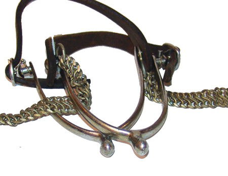 Buermann Star Steel Spurs: Military style spurs with "humane rowells" and fancy chain under-straps. Very good condition. Circa: Early 1900s Size: Adult 6-1/2" x 4"