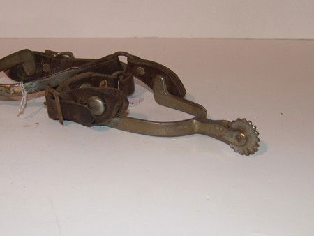 Buermann Ladies Spurs: Fine pair of small rowell spurs in good condition. Circa: Mid 1900s Size: Adult 7-1/4" x 3-1/4"