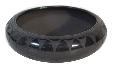 San Ildefonso Pottery Bowl- Maximiliana Montoya: Fine black-on-black shallow bowl with cloud and rain designs. Very good condition, signed "Anna." Circa:Mid 1900s Size:3-1/4" x 9"