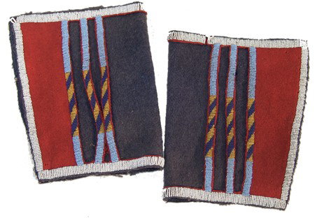 Crow Beaded Leggings: Interesting pair of blue-gray tradecloth moccasin uppers with beaded trim and floating beaded stripes. Very good condition. Circa:Mid/Late 1900s Size:9"