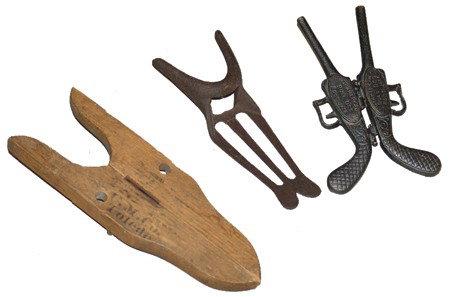 3 Vintage Boot Jacks: A "Bulldog" folding derringer, a simple cast iron version, and one of folding oak marked "U.M. Co. Toledo". All in working condition. Circa:Early/Mid 1900s Size:8-1/2" x 4", 9" x 3-1/2", 11" x 4"