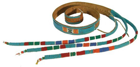 Crow Beaded Belt: Traditional panel belt fully beaded in several styles including the 3 long "tail" suspensions. Very good condition. Circa:Mid 1900s Size:43" x 2"