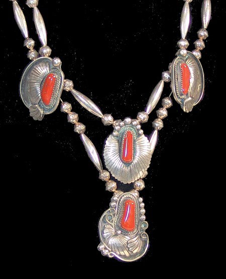 Navajo Necklace: Fine leafwork all silver necklace set with beautiful oxblood red coral stones. Very good condition, hallmarked "JM". Circa:1970s Size:18" long, Pendant 2"