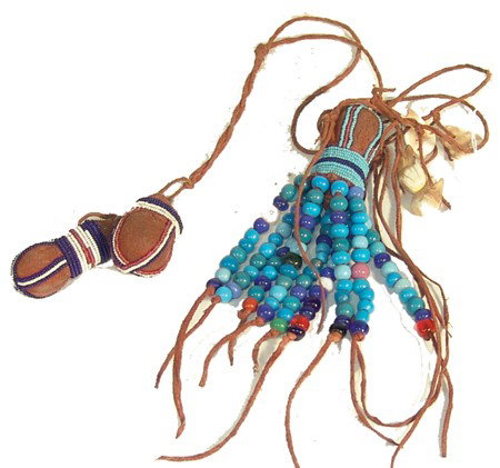 Sioux Rock Medicine: Traditional old style red ochred buckskin fetish balls with beads and fringe. Circa:Late 1900s Size:24" x 2"