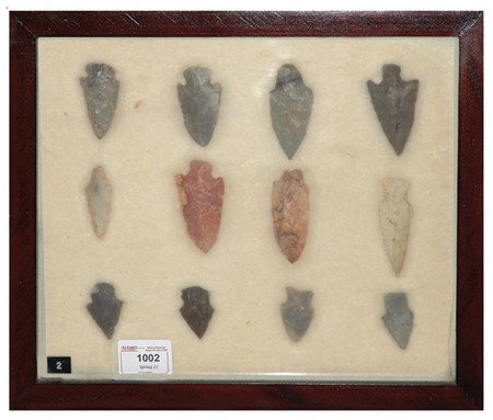 Arrowhead/Relic Collection: Framed collection of 12 assorted stone tools or arrowheads of various ages. Circa:Various Size:11" x 13" framed